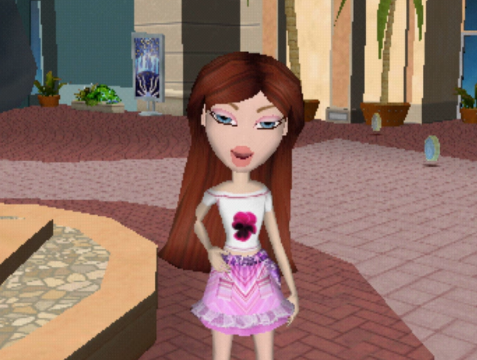 Katia has long reddish brown hair and blue eyes. She wears a white off-the-shoulder top with a pansy on it and a pink and purple skirt that has a sort of stripey patchwork texture to it. She has white skin.